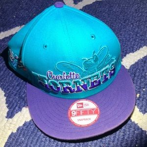 A New Era snapback hat of the Charlotte hornets